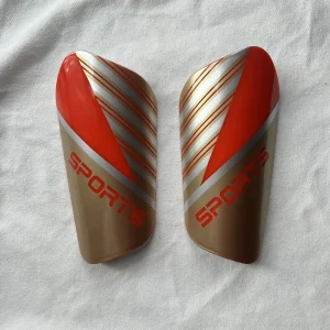 Custom Logo Sublimation PP EVA Soccer Shin Guards for Adults, Orange-Red